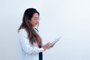 Healthcare Worker In Lab Coat, Using an iPad